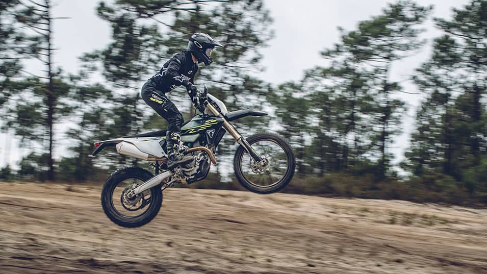 Triumph TF 450-E riding shot through the trees